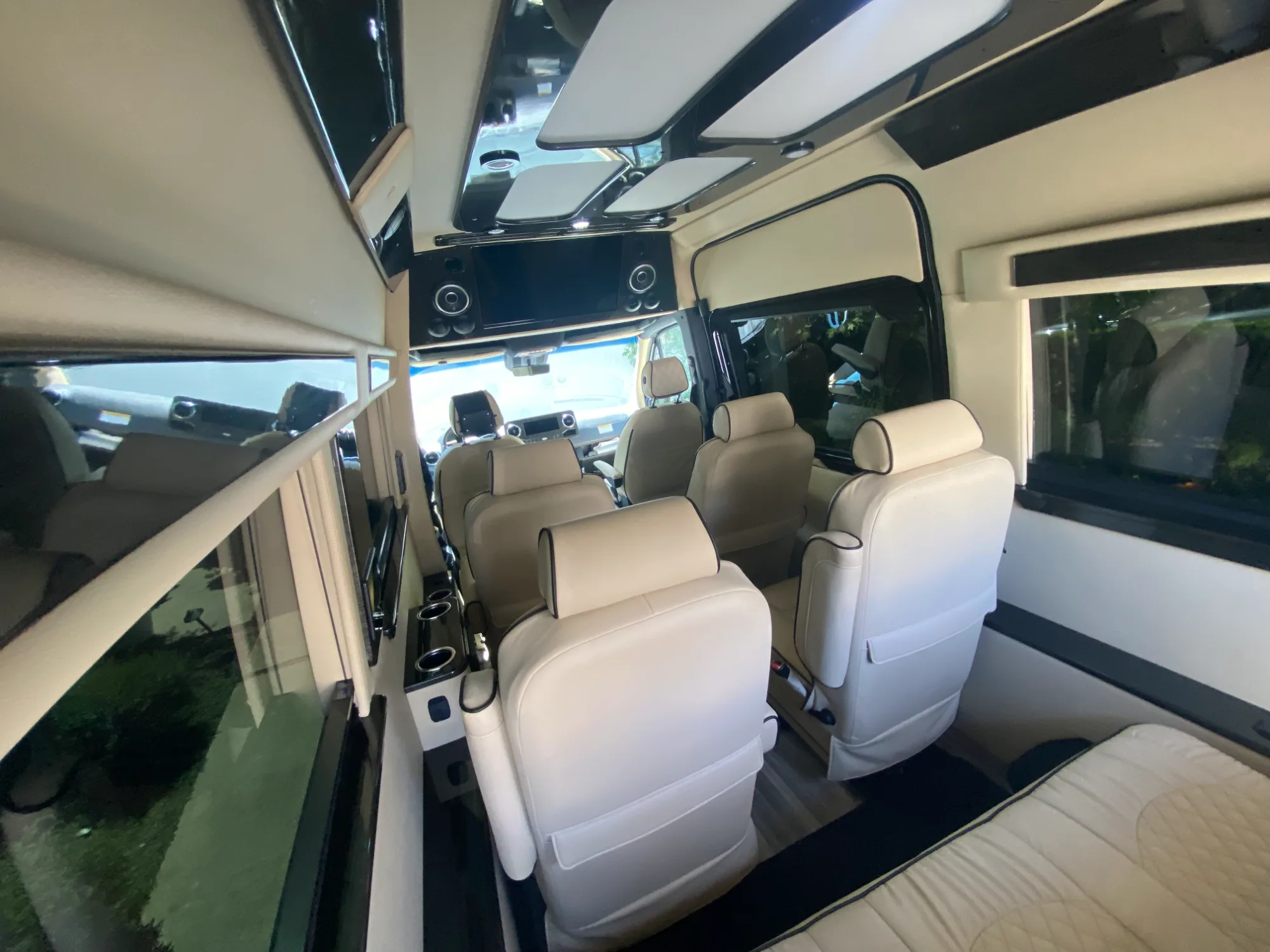 Looking aft down the cabin — privacy shades and valance lighting.