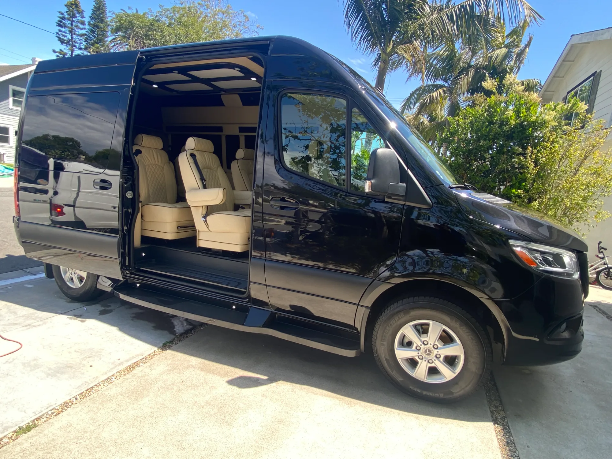 Sliding side door open, showing the fiberglass running board and step.